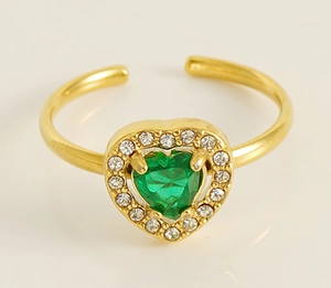 Macro detail of adjustable gold plated ring featuring a green heart stone and zircons