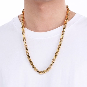 Close-up of 18k gold plated stainless steel interlocking link chain worn by male model