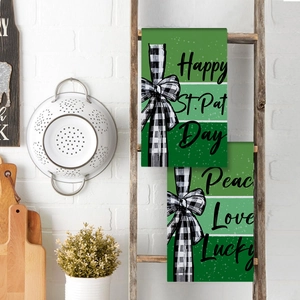 St. Patrick's Day microfiber kitchen towels with buffalo plaid bows on a rustic ladder