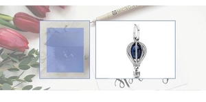 Detailed silver hot air balloon charm with crystal pave and blue spherical gemstone