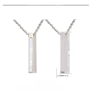 Macro view of 33mm stainless steel bar pendant with white acrylic inlay details