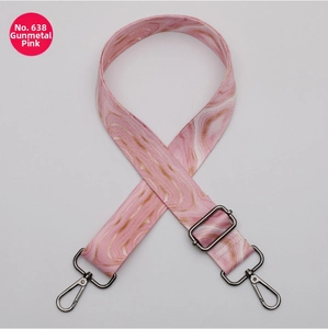 Detail of pink and gold marble pattern bag strap with gunmetal swivel hooks and slider