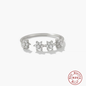 Luxurious S925 sterling silver open ring featuring four snowflake cubic zirconia flowers