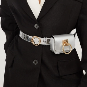 Detail of silver metallic PU leather waist bag with gold circular metal buckle decoration
