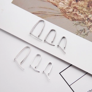 Detailed view of S925 sterling silver U-shaped earring hooks with visible hallmark