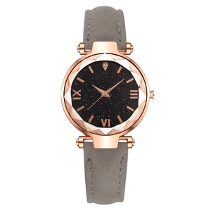 Elegant rose gold starry sky ladies watch with grey suede strap on white background