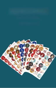 Close-up of Christmas countdown stickers with numbered Santa and reindeer designs