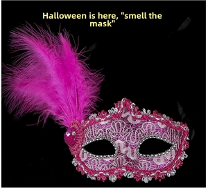 Detail of rose pink lace masquerade mask with vibrant feathers and silver bead trim
