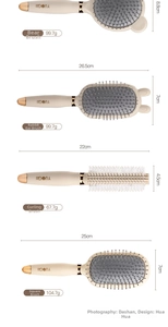 Detail view of four cream-colored hairbrushes with bear, rabbit, round, and paddle designs