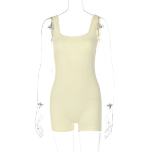 Detail of light yellow sleeveless bodysuit with round neck on a mannequin