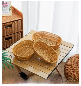 Detailed texture of hand-woven oval fruit baskets in a three-piece nesting set