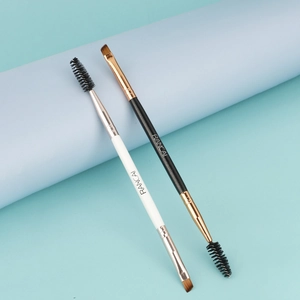 Dual-ended eyebrow and eyelash brush set with spoolie and angled bristles in black and white