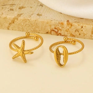 Detail view of gold adjustable rings featuring starfish and seashell nautical designs