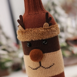 Christmas reindeer knitted wine bottle cover with soft fur trim and festive decor
