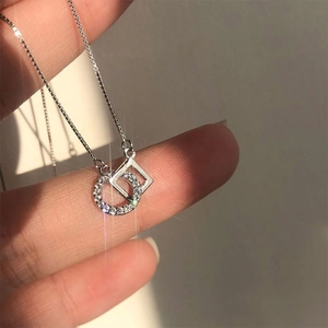 Titanium steel necklace featuring intertwined silver rings with micro-set zircon
