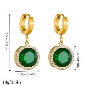 Golden earrings with round green emerald gemstones and white diamonds on white background