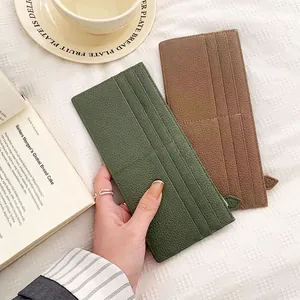 Slim leather card holder with multi-slot design in dark green and brown colors