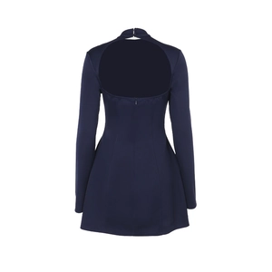 Detail of navy blue backless dress showing deep open back design and zip closure