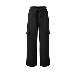 Detailed view of elastic drawstring waistband and cargo pockets on black linen trousers
