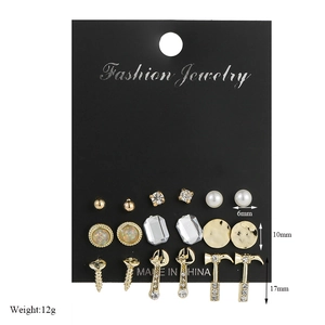 Detail view of 9 pairs of gold geometric earrings with size and weight measurements