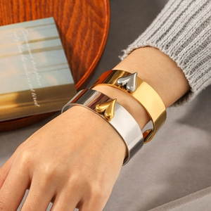 Minimalist wide open heart cuff bracelets in polished gold and silver finishes
