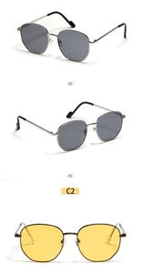 Detail view of round metal sunglasses in silver and bronze with color code C2