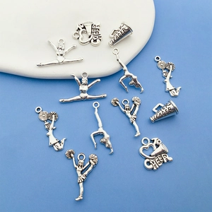 Macro shot of silver cheerleader charms with Cheer Leader engraving on a blue background