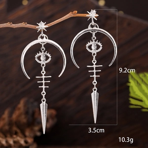 Gothic silver crescent moon devil eye earrings with fishbone drops in a vintage style