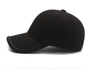 Detail view of the black cotton baseball cap side profile with logo and curved brim