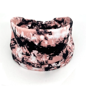 Detail showing soft pink and black tie-dye pattern on elastic cotton yoga headband