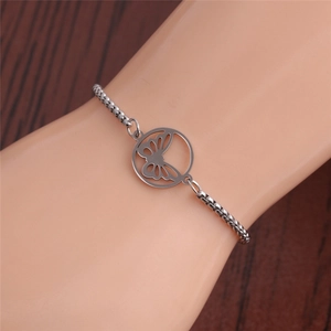 Silver stainless steel butterfly pendant box chain bracelet worn on a person wrist