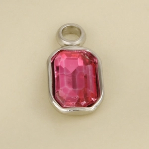 Close-up of a pink rectangular faceted glass pendant with stainless steel silver setting