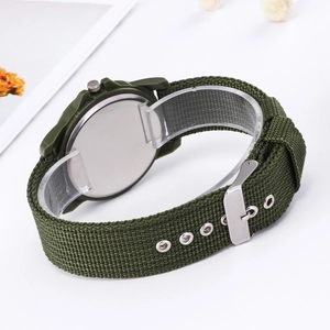 Detail of army green nylon strap and stainless steel case back of the quartz watch