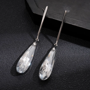 Sleek silver crystal teardrop earrings with faceted drop pendants for a chic look