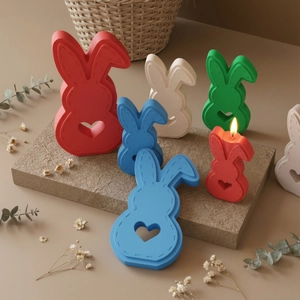 Detail of bunny candle mold with heart cutout and stitched edge in multiple vibrant colors