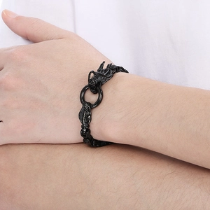 Detail of male model wearing retro dragon head stainless steel chain bracelet in black