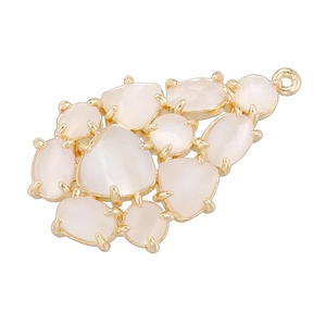 Detailed view of leaf-shaped cluster pendant with white stones and gold-plated setting