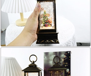Detail of vintage bronze Christmas lantern with liquid glitter and Santa Claus scene