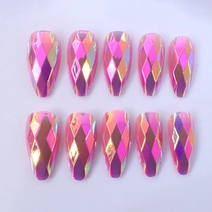 Detail view of pink iridescent long almond press-on nails with faceted gemstone texture