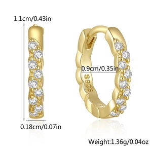 Detail of S925 sterling silver hoop earrings with gold plating and cubic zirconia rows