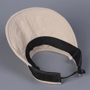 Detail view of foldable sun visor hat showing inner sweatband and adjustable elastic cord