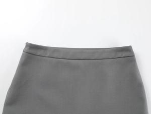 Detailed macro view of the grey mini skirt high waist showing premium fabric texture