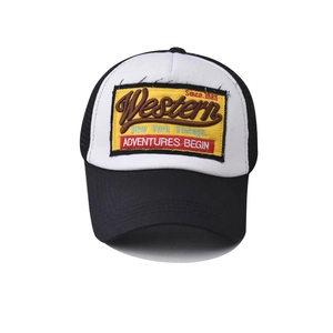 Detailed embroidery on vintage black and white mesh trucker hat with Western text patch