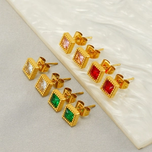 Macro shot of square gold-plated stud earrings featuring pink, white, green, and red stones