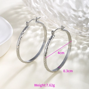 Detail of silver chain texture hoop earrings with 4cm diameter and latch back closure