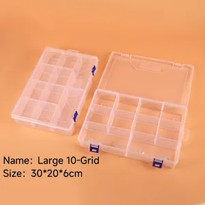 Macro detail of large 10-compartment clear plastic organizer box with blue safety buckles