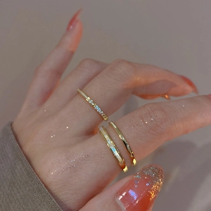 Close-up of gold-plated double-layer ring set with zircon pavé and smooth finish band