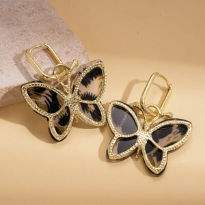 Chic butterfly earrings with animal print patterns and golden metal U-shaped hoops