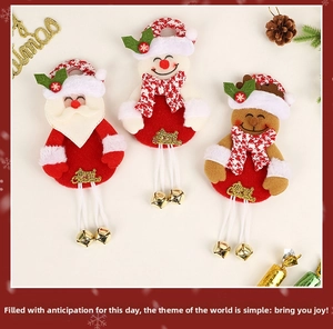 Detailed view of plush Santa Claus, snowman and reindeer ornaments with golden bells