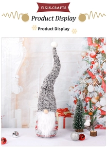 Detail of grey knitted tall hat and long white beard on a plush Christmas gnome figure